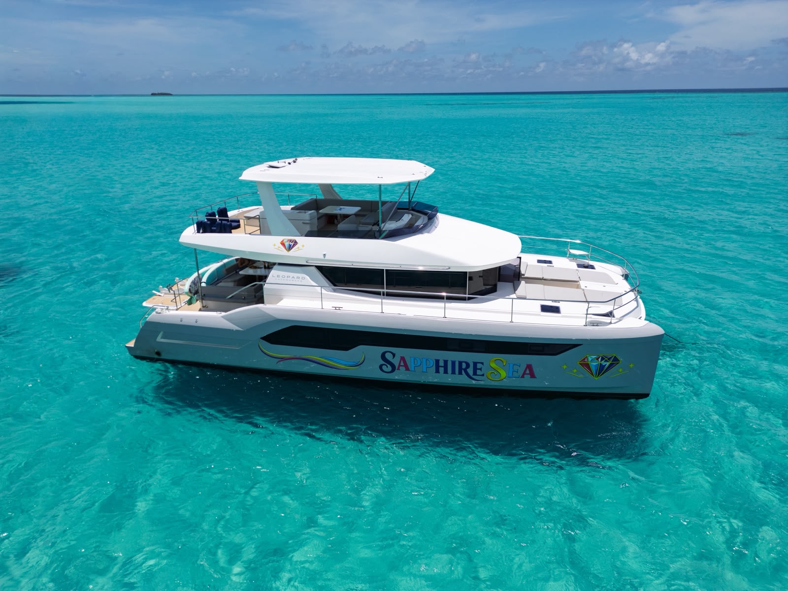 Sapphire Sea catamaran full side profile in open turquoise water