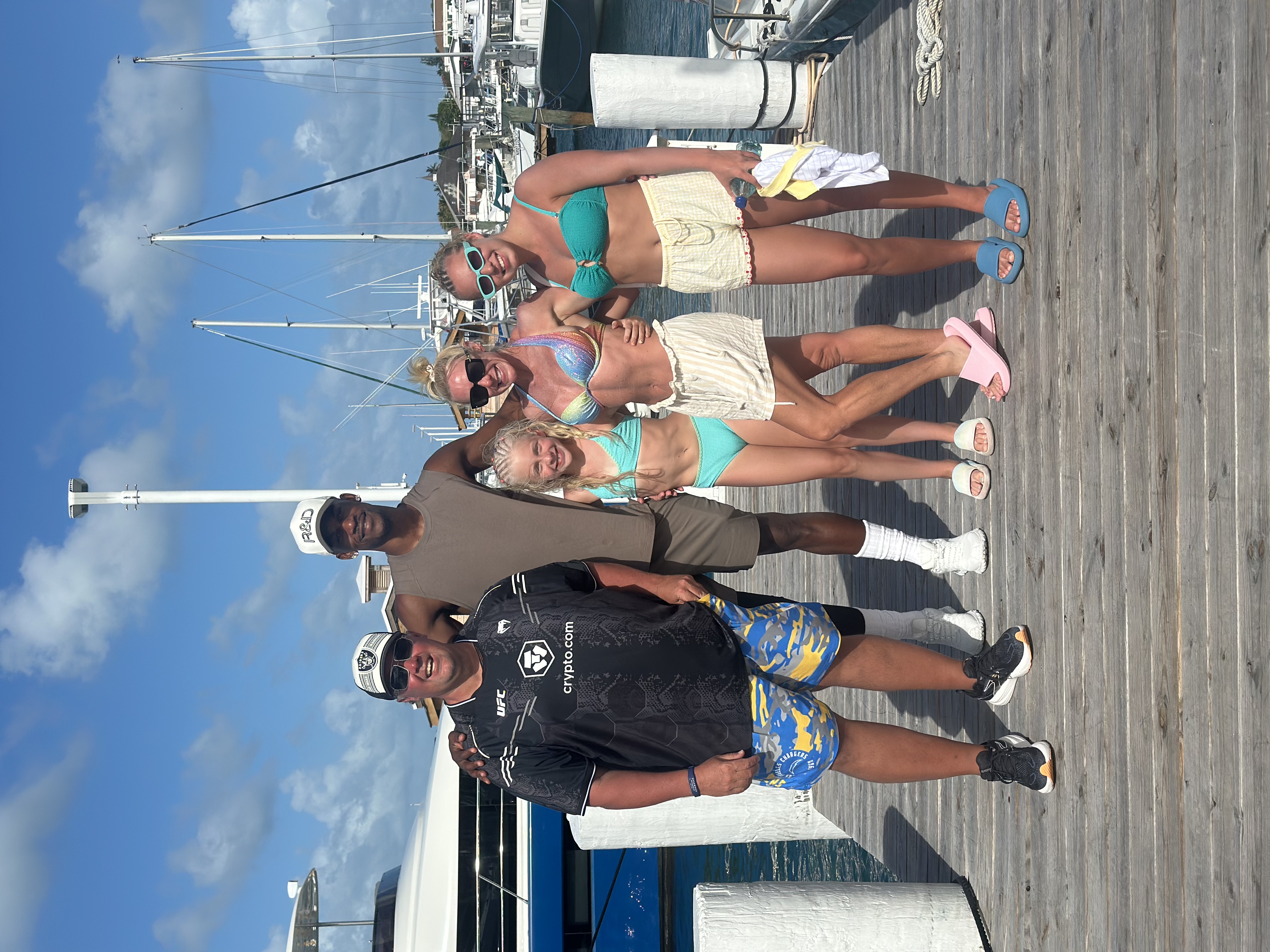 Guests smiling together on the marina dock